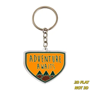 Adventure Awaits Keychain Retro Shield Acrylic Charm with Mountain Peaks Bold Orange Background Inspirational Outdoor Accessory