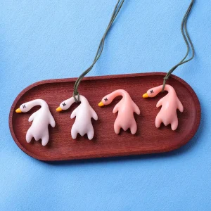 Color changing UV Light Reactive Roast Duck Keychain PVC Material Fashionable Animal Pattern Creative Toy for Car Bag Hanging
