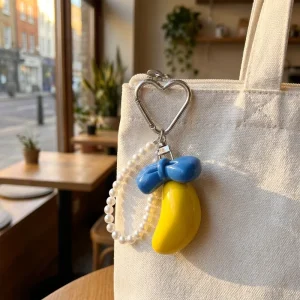 Cute 3D Banana Bow Pearl Chain Bag Charm Keychain with Heart Clip Fruit Pendant for Purse Car Phone