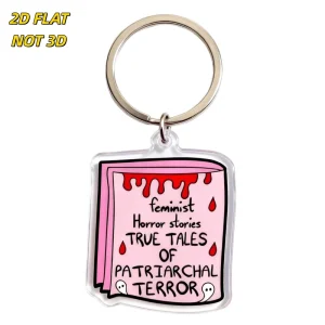 Feminist Horror Stories Acrylic Keychain Pink Book Design with True Tales of Patriarchal Terror Text Blood Drips & Ghosts