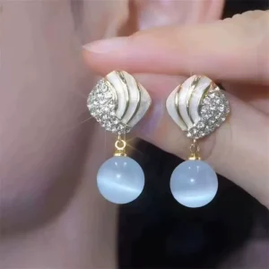 Korean Elegant Cat’s Eye Women’s Zinc Alloy Electroplated Earrings New Fashion High end Sense All match Oil Dropping