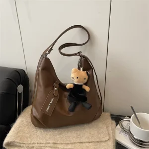 New Aesthetic Soft PU Leather Hobo Bag with Plush Cat Charm Large Capacity Slouchy Shoulder Bag for College Students