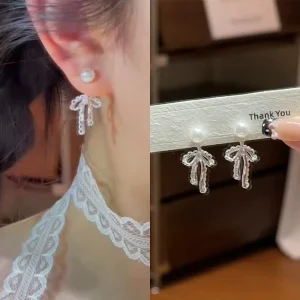Simple Luxury Alloy Earrings Hollow Niche Design Lace Bow Pearl Drop for Party Fashionable All Match Jewelry Mainly Made Brass