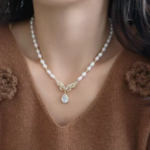 Zhuji Natural Freshwater Pearl White Oval Necklace Women Elegant Fashionable High End Vibe Featuring Wing Pendant Niche